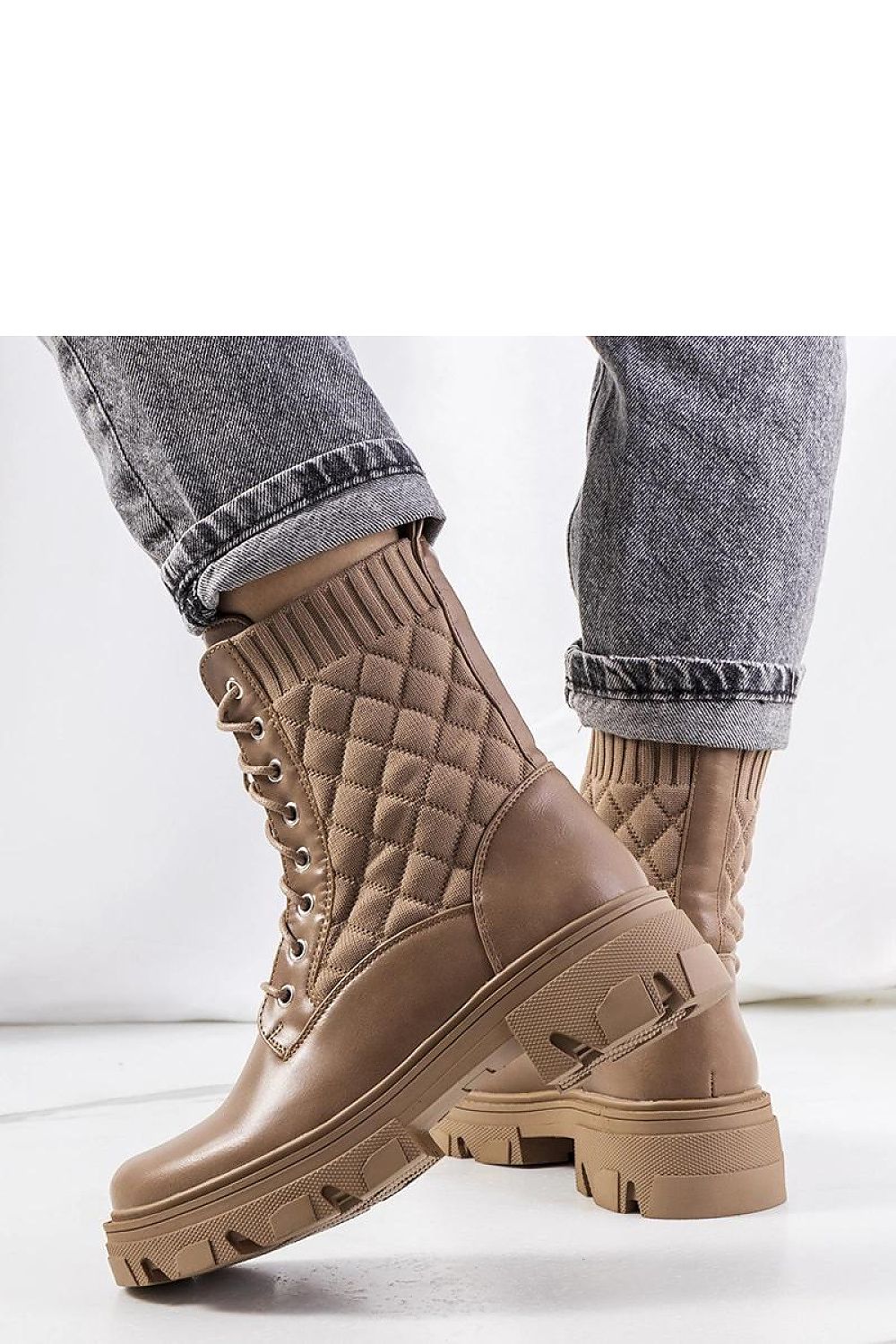 Luxurious Solea Lujan ankle boots featuring a stylish brown sock-like upper, ideal for cooler autumn and winter days.