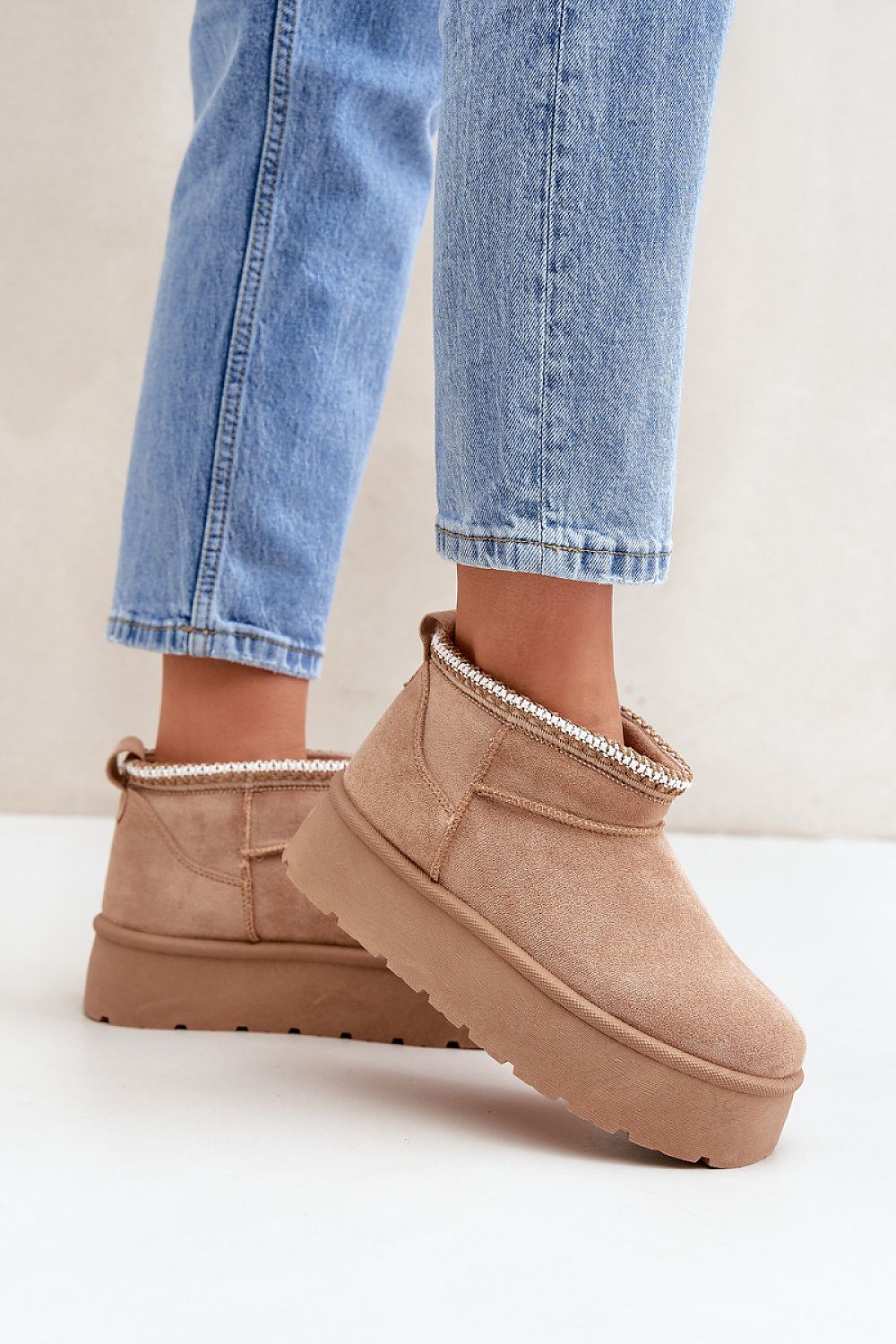 Step in style's Luxury Women's Snow Boots, designed with eco suede and fur lining, showcasing a chic platform suited for cold weather.