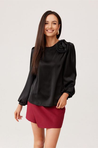 Detail of the round neckline and rose accent on the Evelyn Satin Blouse, designed for luxurious comfort by Roco Fashion.