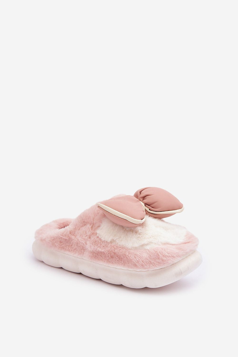 Luxurious Women's Cozy Fur Slippers with Bow from Step in style showcasing a charming bow detail and thick sole for added stability.