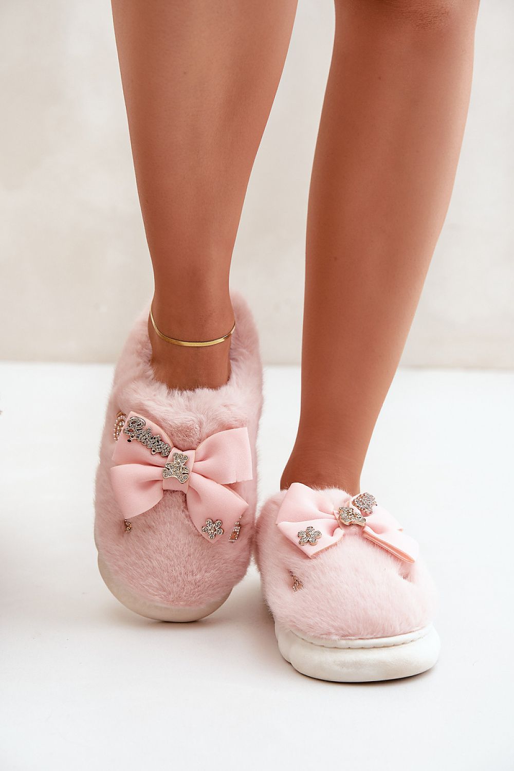 Luxurious Furry Slippers by Step in Style, showcasing soft comfort with stylish buttons and a bow, perfect for cosy homewear.