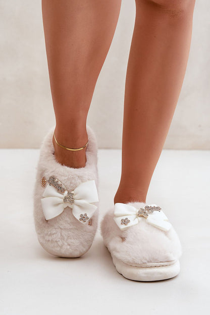 Elegant and cozy Luxurious Furry Slippers by Step in Style, designed for ultimate comfort with charming bow and button details.