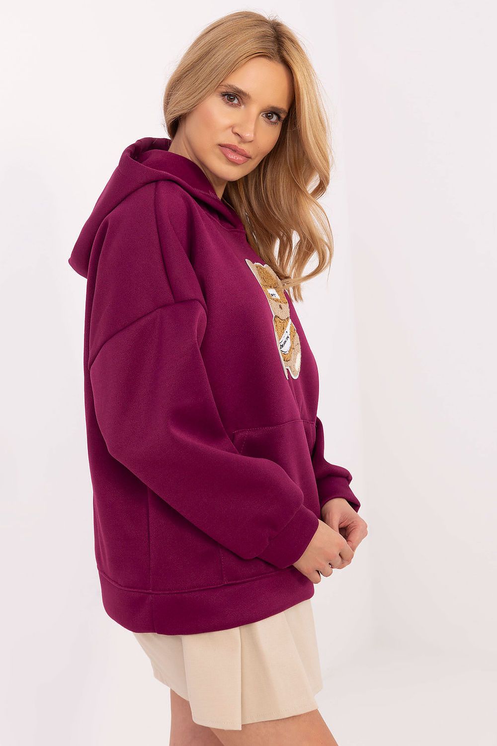 Trendy Women's Stylish Sweatshirt with Hood and Kangaroo Pocket by Italy Moda, ideal for colder days with its soft polyester fabric.