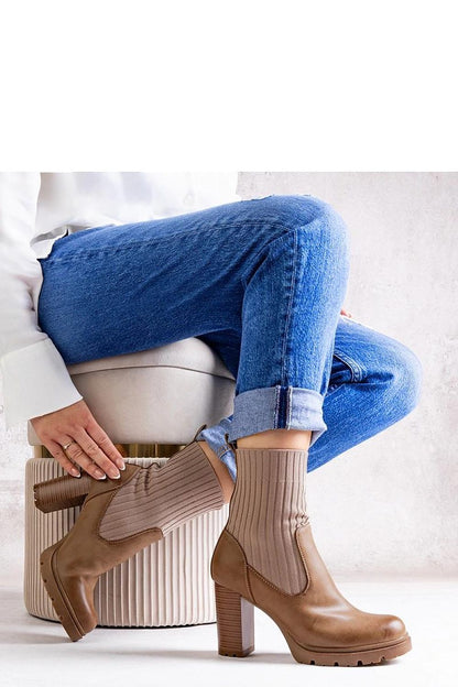 Solea dark beige stiletto ankle boots displayed on a model, highlighting their versatility for stylish autumn outfits.