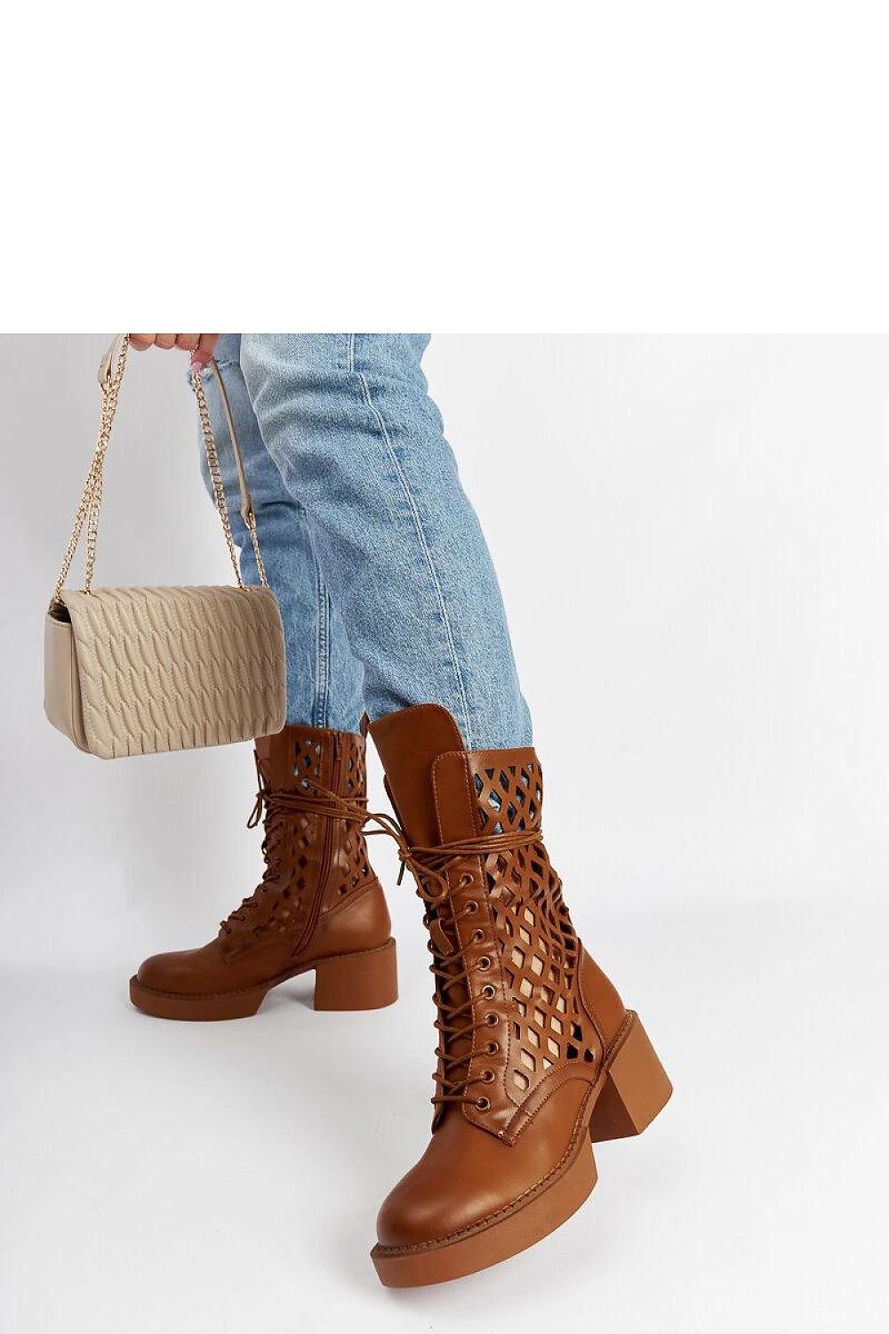 Chic brown ankle boots featuring a flexible rubber strap and zipper, crafted by Solea, ideal for comfort and luxury.