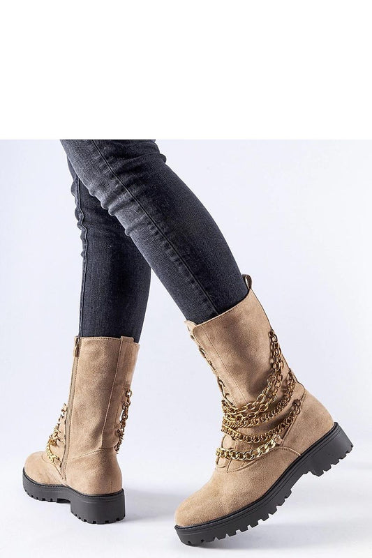 Luxurious beige insulated ankle boots by Solea featuring a decorative chain, perfect for autumn and winter wear. Ideal for keeping feet warm and stylish in colder weather.