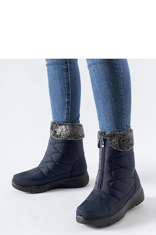 Luxurious navy blue snow boots by Solea featuring a modern design with a round toe and high shaft, perfect for winter fashion.