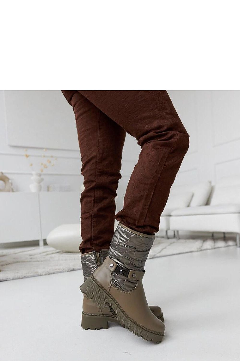 Close-up view of Solea Green Insulated Lido Ankle Boots, highlighting the high-quality rubber construction and modern flat heel for stylish winter footwear.