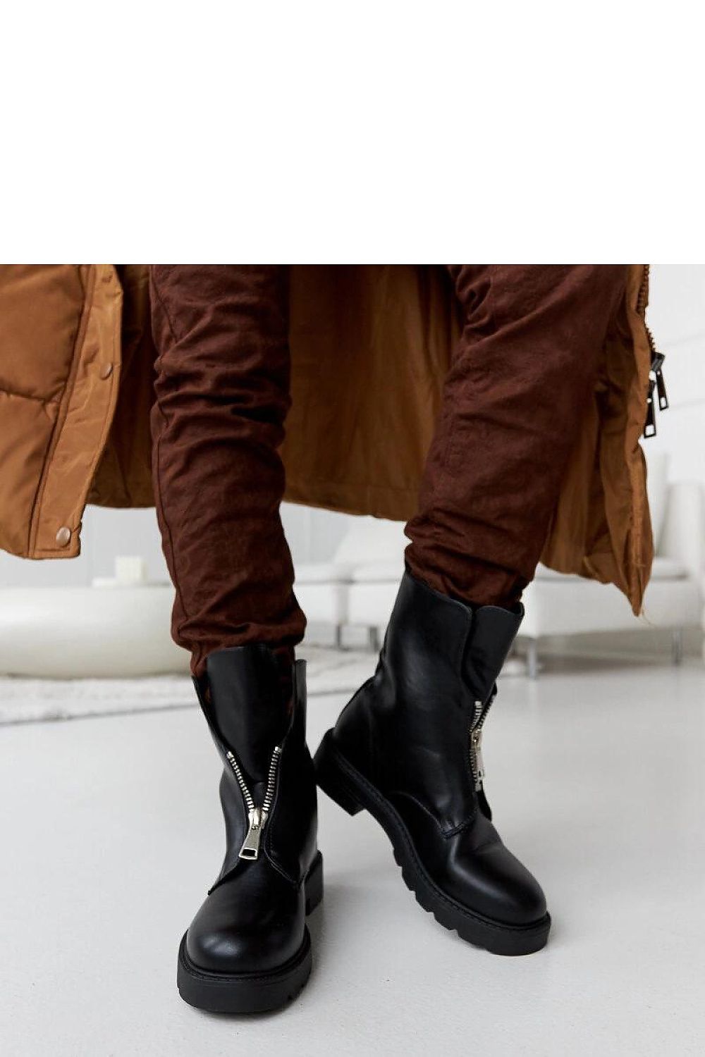 Fashion-forward black insulated ankle boots by Solea ideal for women, highlighting their delicate rounded toe and rubber sole.