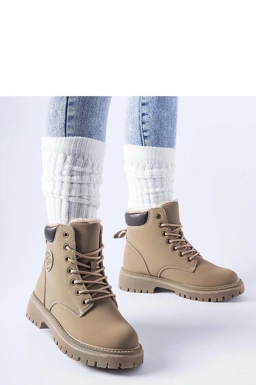 Elegant brown insulated Medole winter boots by Solea displayed on a stylish background, showcasing the modern laced design and round toe for fashionable comfort.