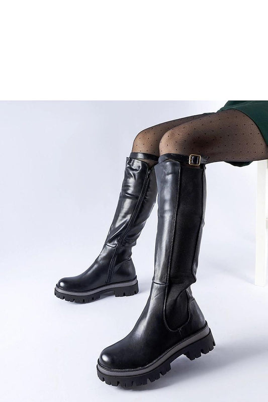 Elegant Solea luxury black thigh-high boots with decorative Stuart strap, ideal for winter fashion. Crafted from high-quality eco-leather with a comfortable medium heel and warm interior. Perfect for stylish and practical everyday wear.
