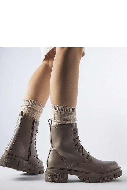 Close-up view of Solea Women's Insulated Work Boots features, highlighting the practical side zipper and laced front for easy wear.