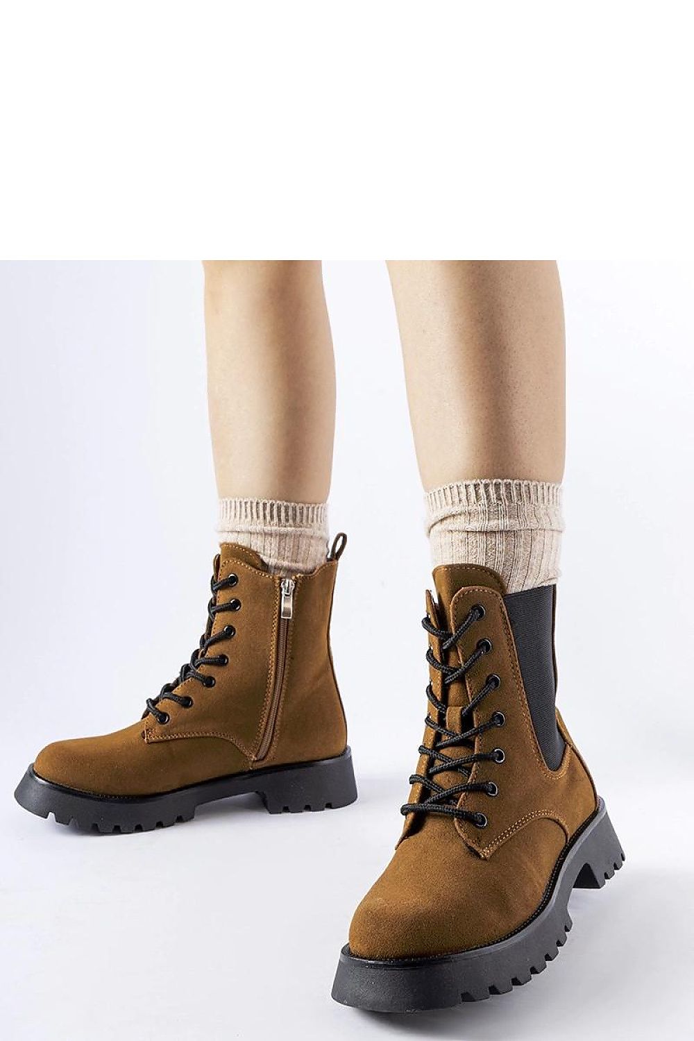 Elegant Solea brown ankle boots featuring a chunky sole crafted from eco leather, ideal for winter fashion. Perfect blend of style and comfort.