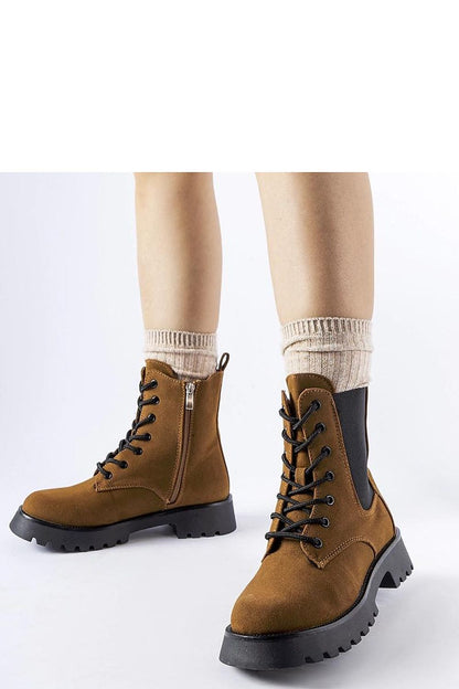 Elegant Solea brown ankle boots featuring a chunky sole crafted from eco leather, ideal for winter fashion. Perfect blend of style and comfort.