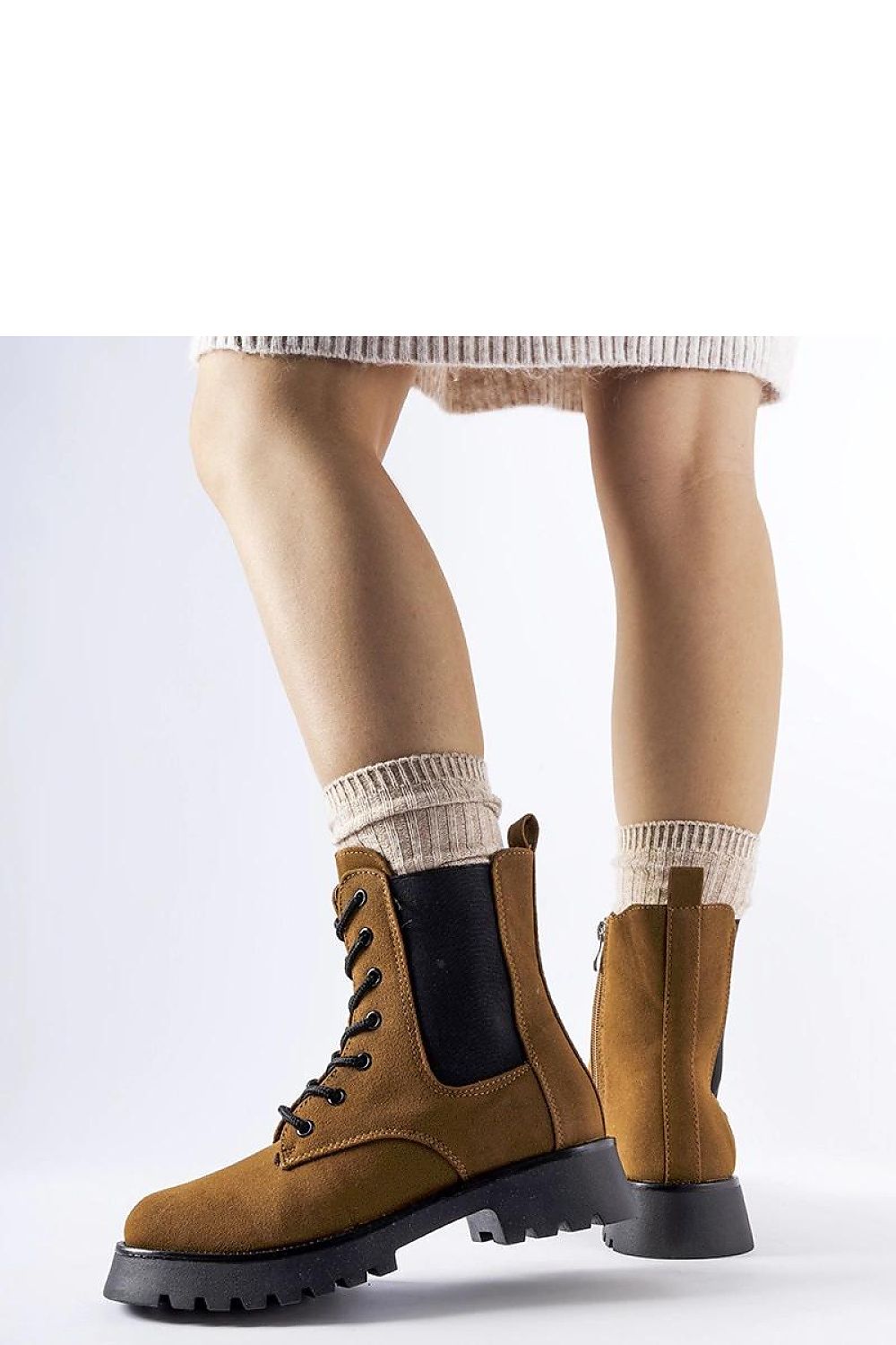 Stylish Solea eco leather ankle boots in brown with a modern design, showcasing a flat chunky heel and round toe for ultimate comfort.