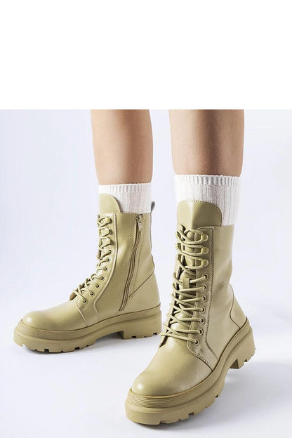 Solea luxury green flat winter boots showcasing high ankle design and durable rubber exterior, perfect for cold weather protection.