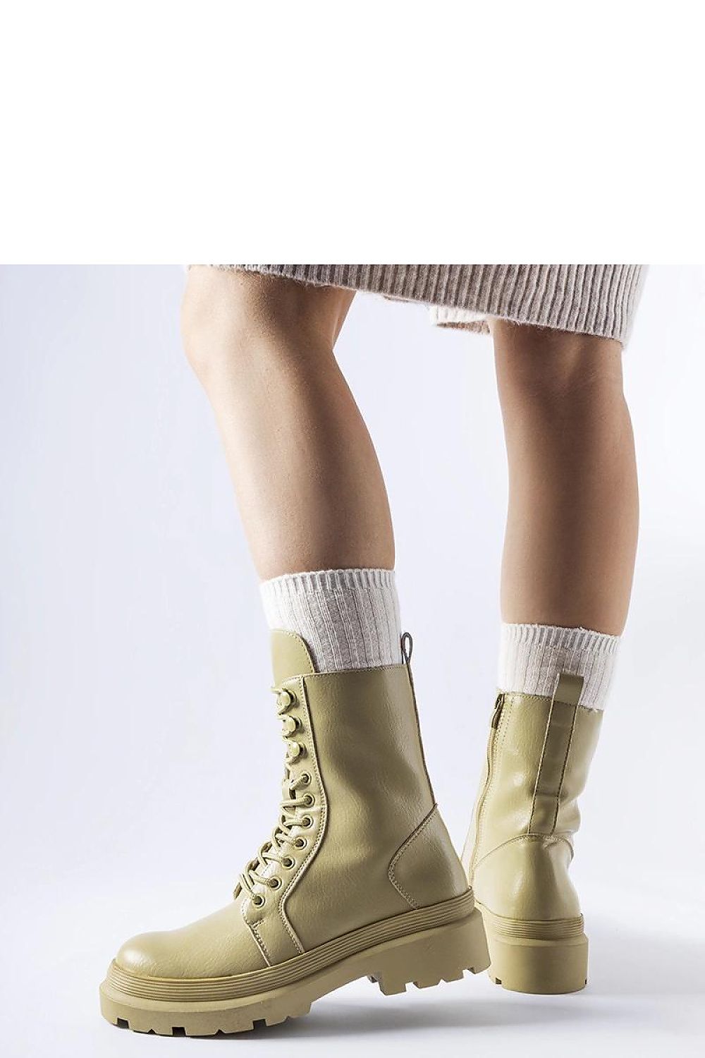 Stylish green winter boots by Solea featuring durable rubber construction and high ankle for enhanced protection during chilly days.