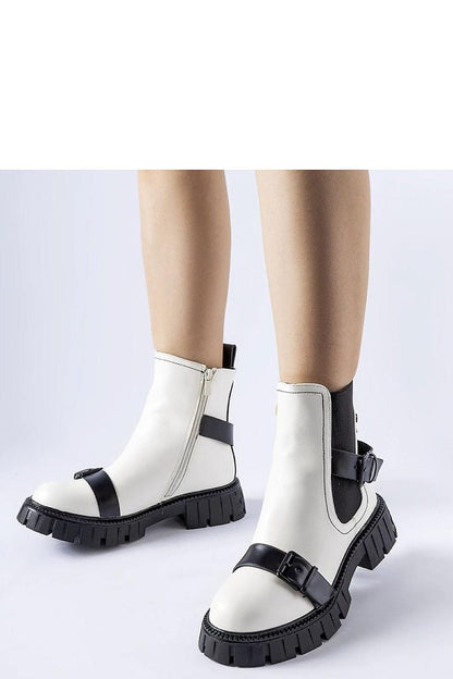 Stylish black ankle boots with a feminine touch by Solea, featuring eco leather for sustainable luxury.