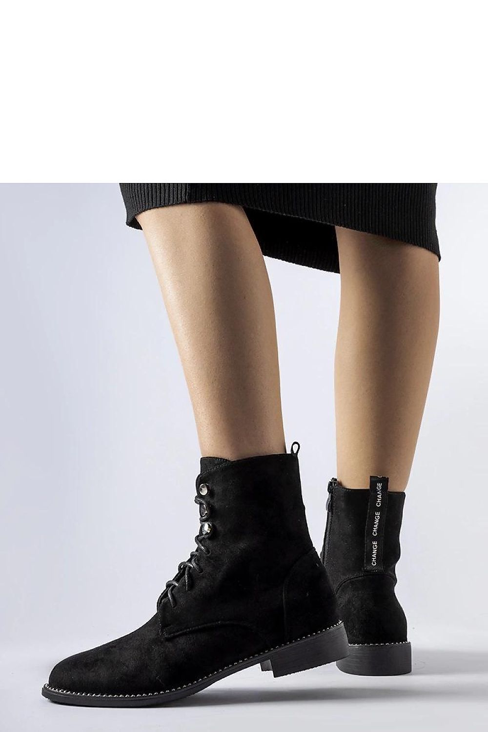 Close-up of Solea's black eco-suede ankle boots with comfortable grip sole, featuring a sleek round toe ideal for both casual and formal wear.