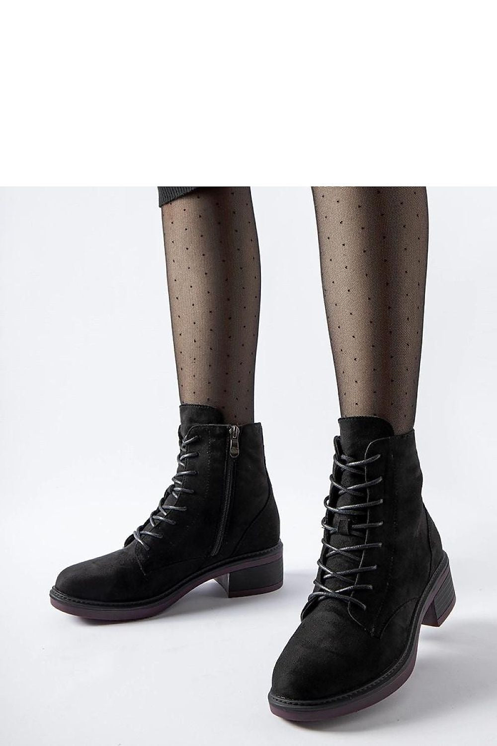 Solea classic black ankle boots with a distinctive purple sole, crafted from high-quality eco leather, featuring insulated comfort for colder days, ideal for an elegant autumn-winter wardrobe.