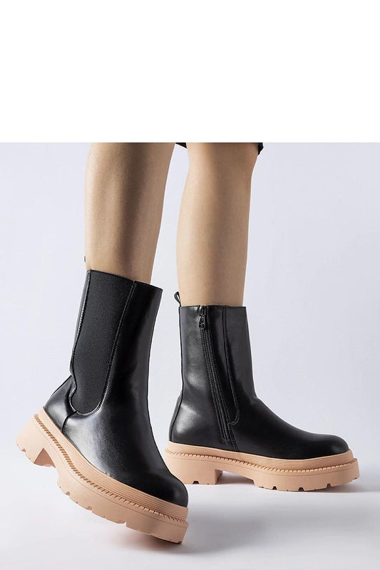 Elegant Solea black ankle boots with a unique light pink sole, featuring a practical side zipper, ideal for chic and comfortable everyday wear.