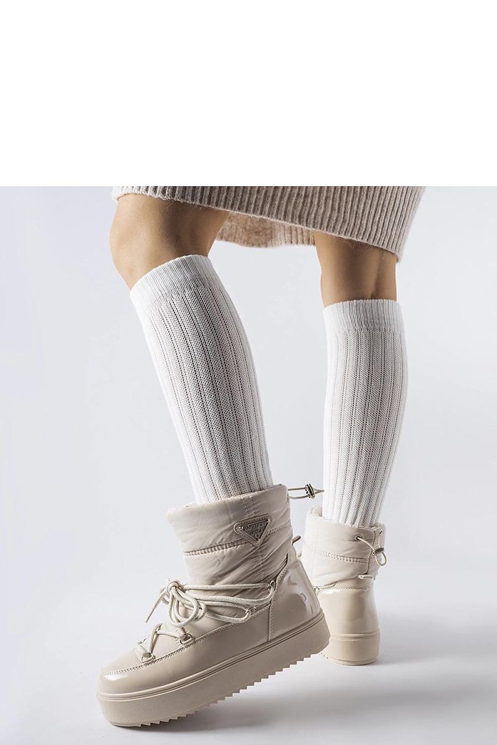 Luxury beige insulated snow boots by Solea, featuring a stylish slip-on design and round toe for comfort and protection against winter elements.