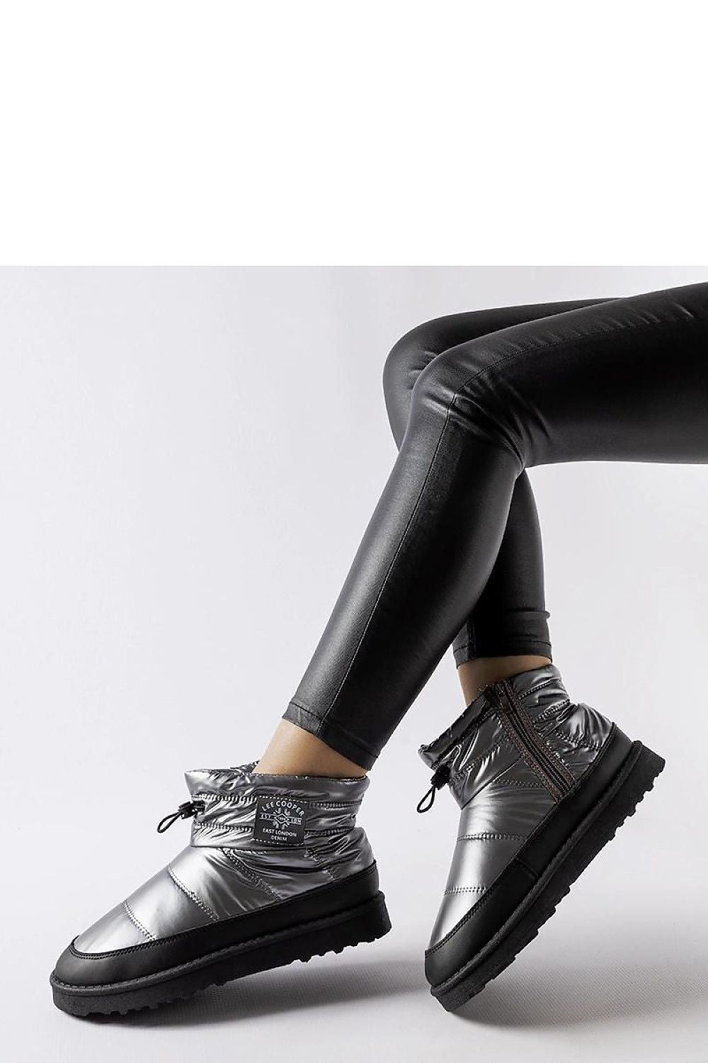 Close-up of the premium synthetic leather exterior of Lee Cooper LCJ-23-44-1966L Snow Boots, highlighting their modern design and luxurious finish.