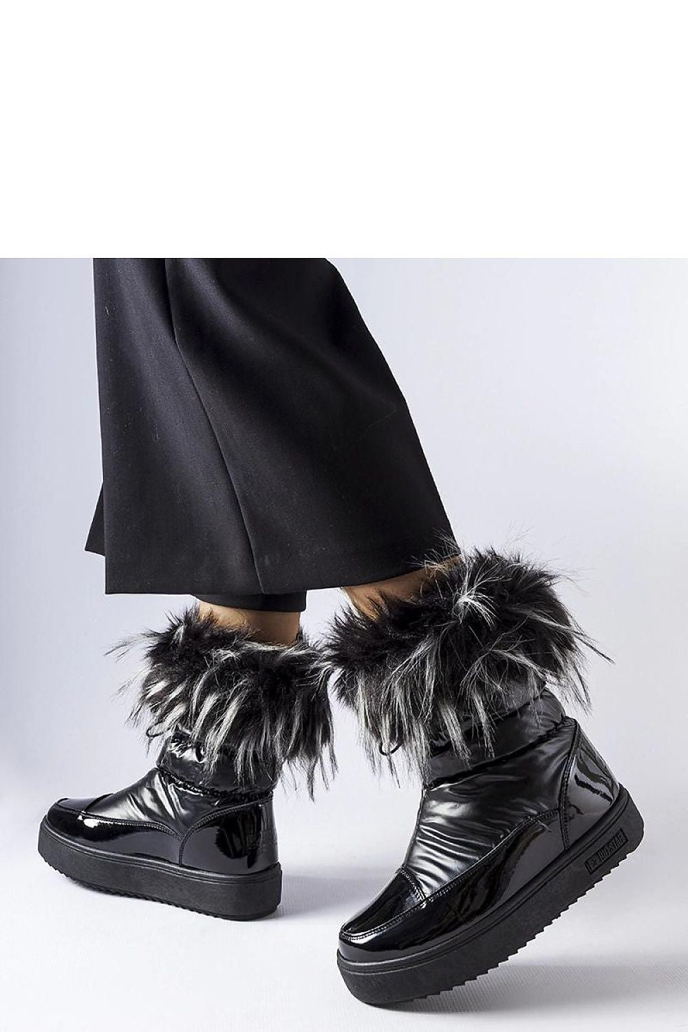 Solea Black Insulated Snow Boots displayed on a snowy background, demonstrating their perfect blend of functionality and luxury for cold weather adventures.