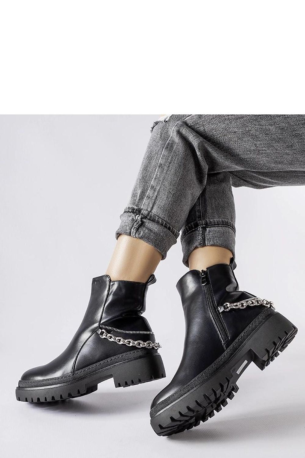 Sophisticated brown ankle boots designed by Solea with a convenient zipper closure and moisture-resistant rubber material, ideal for all weather conditions.