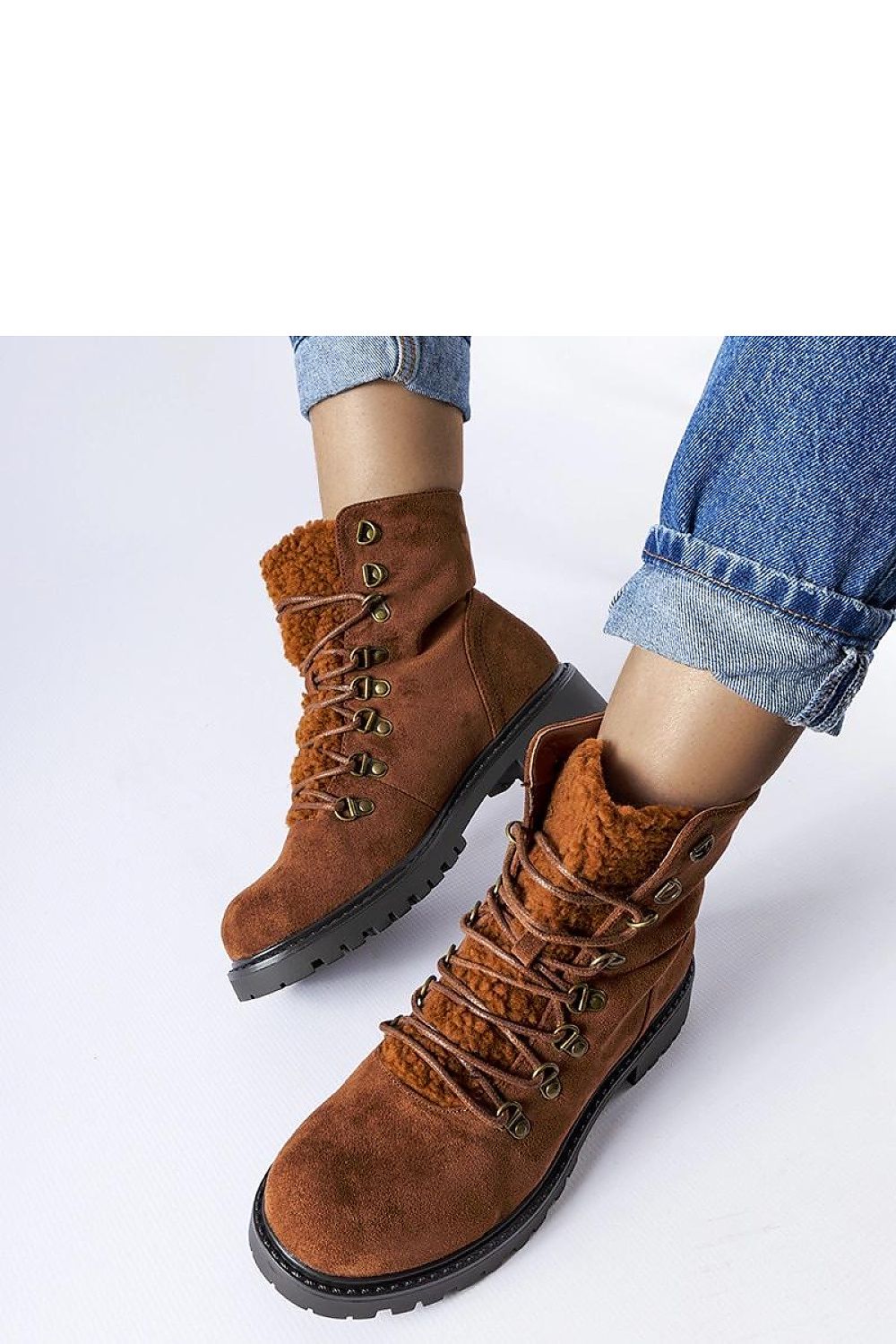 Close-up of Solea eco-suede ankle boots, highlighting the intricate detailing and lace-up closure that combine style and comfort for the modern woman.