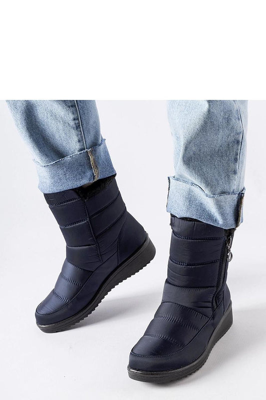 Elegant navy women's snow boots with low wedge by Solea, featuring an insulated design for warmth and stylish round toe, perfect for winter fashion.