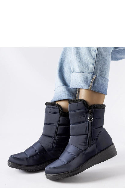 Stylish insulated women's snow boots from Solea in navy, showcasing a low wedge heel and a convenient zipper closure, ideal for both casual and formal winter attire.