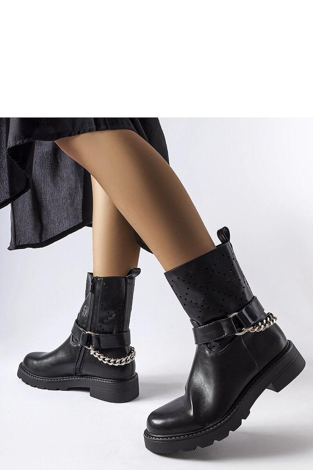 Solea Black Vegan Leather Ankle Boots elegantly designed with a statement chain, showcasing a round toe and flat heel for ultimate comfort, perfect for autumn and winter fashion.