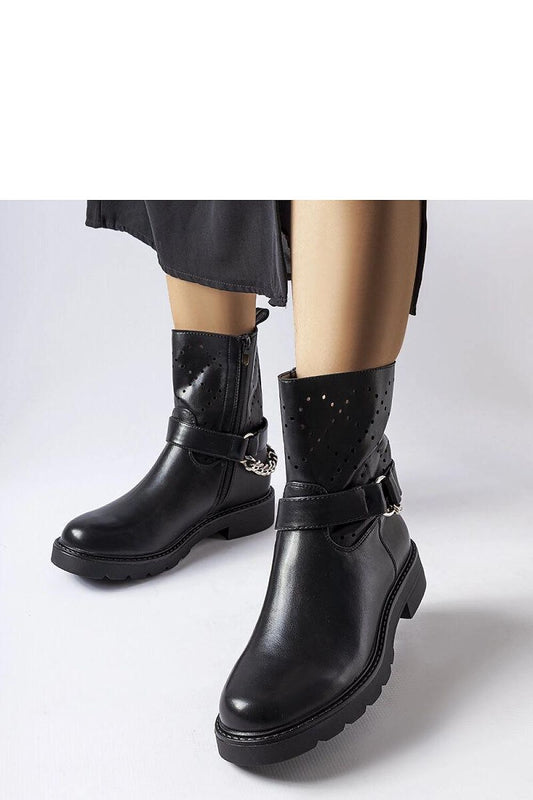 Stylish Solea Vegan Leather Ankle Boots in black, featuring a practical zipper and sturdy rubber sole, ideal for chic winter outfits and all-day wear.