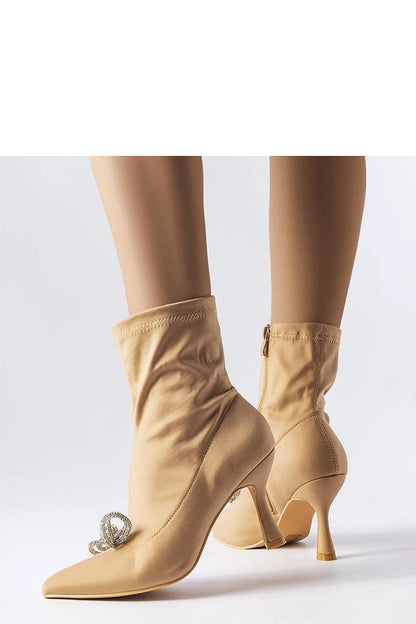 Close-up of Solea rhinestone bow ankle boots in elegant beige, highlighting high-quality fabric and side zipper for easy wear in chic fall styles.