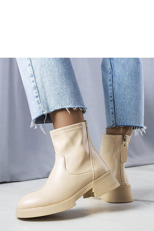 Elegant Solea beige faux leather ankle boots with practical back zip, showcasing luxurious design perfect for autumn-winter styling.