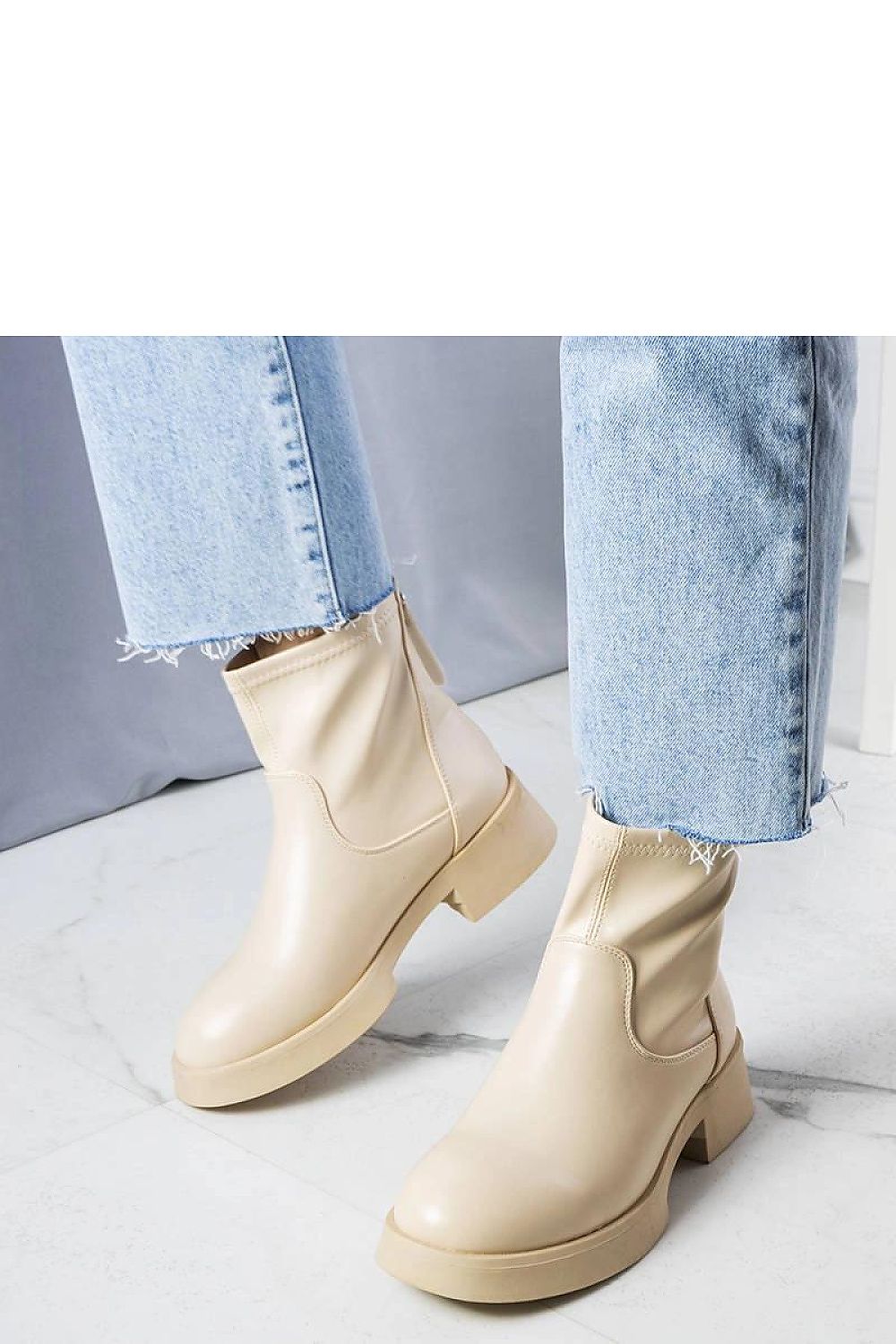 Elegant Solea beige faux leather ankle boots for women, featuring practical zip closure and a durable rubber sole, ideal for autumn-winter fashion.