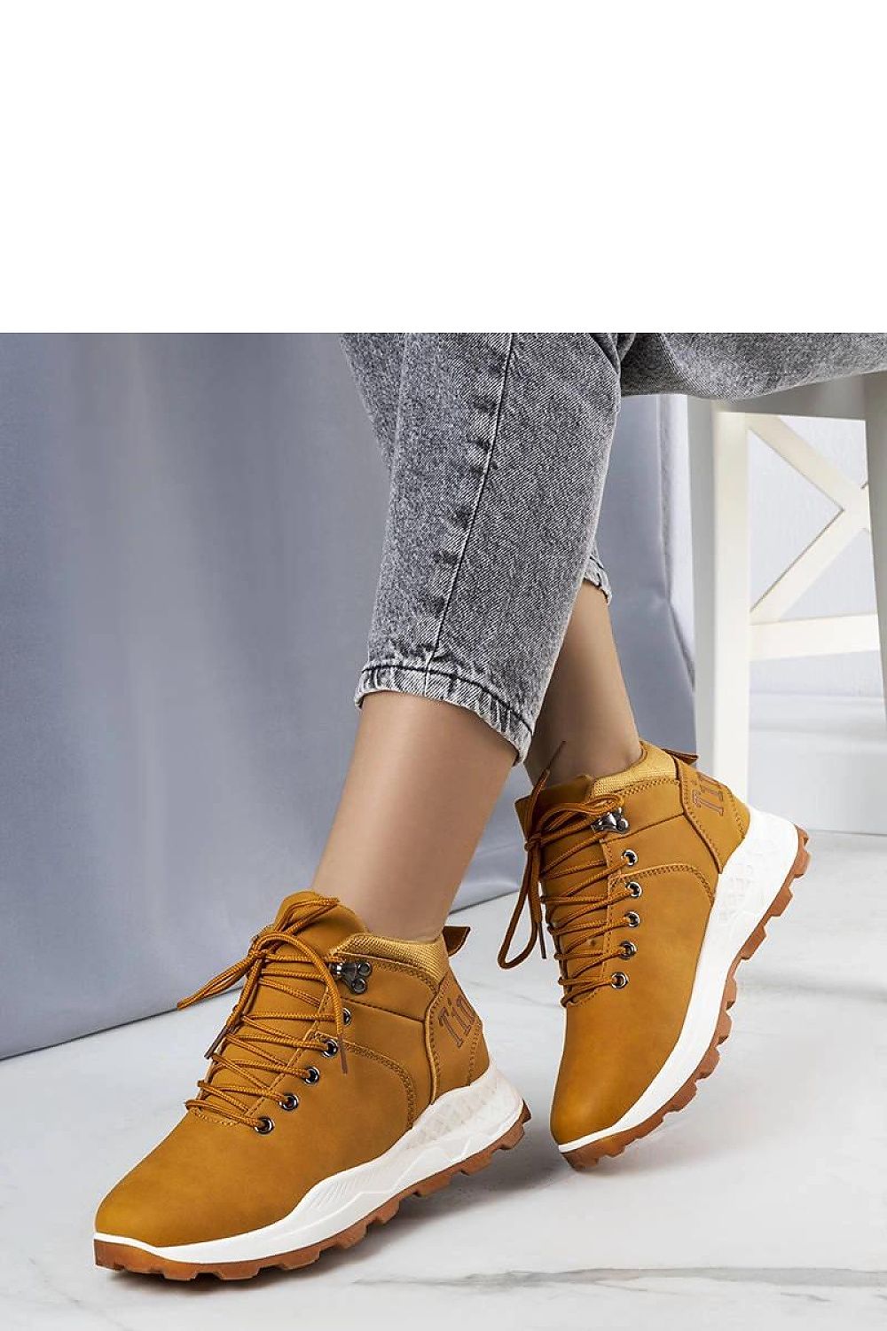 Solea Women's Brown Adleri Trekking Shoes, elegantly designed for comfort and insulation in cooler weather, showcasing a practical lacing system and white rubber sole.