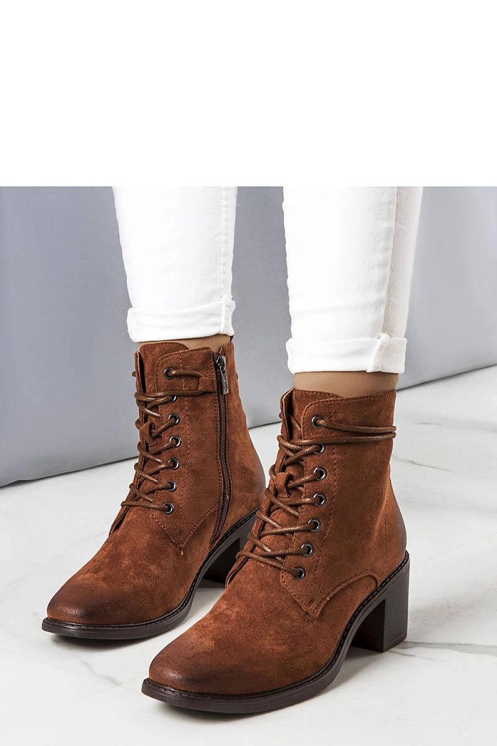 Elegantly crafted Solea Sanlow brown suede ankle boots featuring a stylish square toe and intricate ankle laces, ideal for autumn fashion.