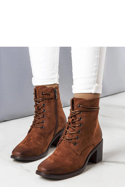 Elegantly crafted Solea Sanlow brown suede ankle boots featuring a stylish square toe and intricate ankle laces, ideal for autumn fashion.