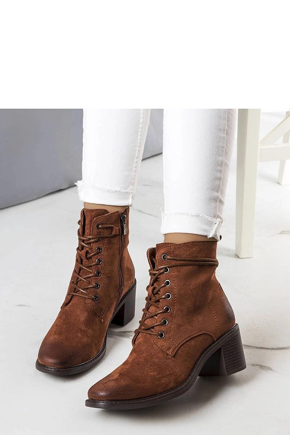 Side view of Solea brown suede eco-leather ankle boots, showcasing a 6.5cm heel and high shaft with zipper, perfect for luxurious autumn styling.