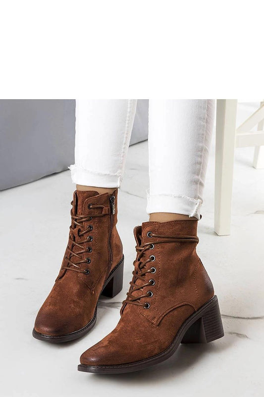 Side view of Solea brown suede eco-leather ankle boots, showcasing a 6.5cm heel and high shaft with zipper, perfect for luxurious autumn styling.