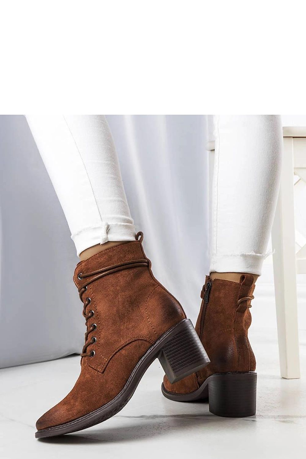 Close-up of the Solea Sanlow ankle boots, highlighting the soft suede eco-leather texture and lace-up design for a sophisticated look.