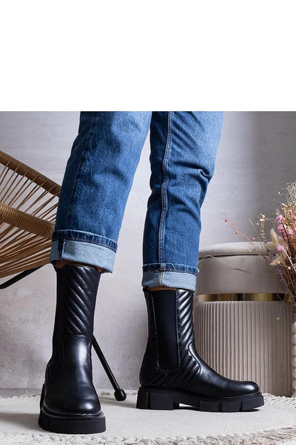 Solea Kevin Ankle Boots in black, showcasing luxurious design elements with decorative strap and lightly insulated features, perfect for Autumn/Winter styling.