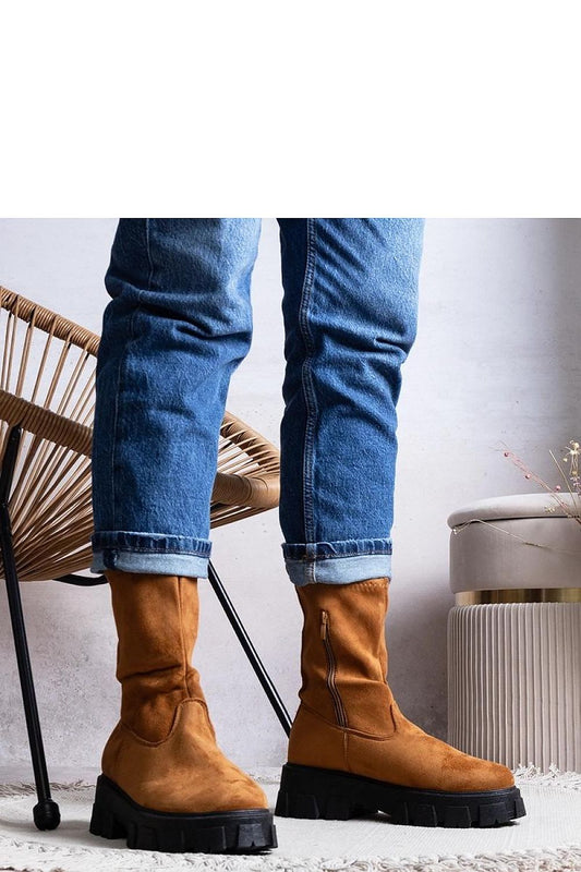 Luxurious brown faux suede ankle boots featuring a rubber sole, designed by Solea for warmth and sophistication in cooler weather.