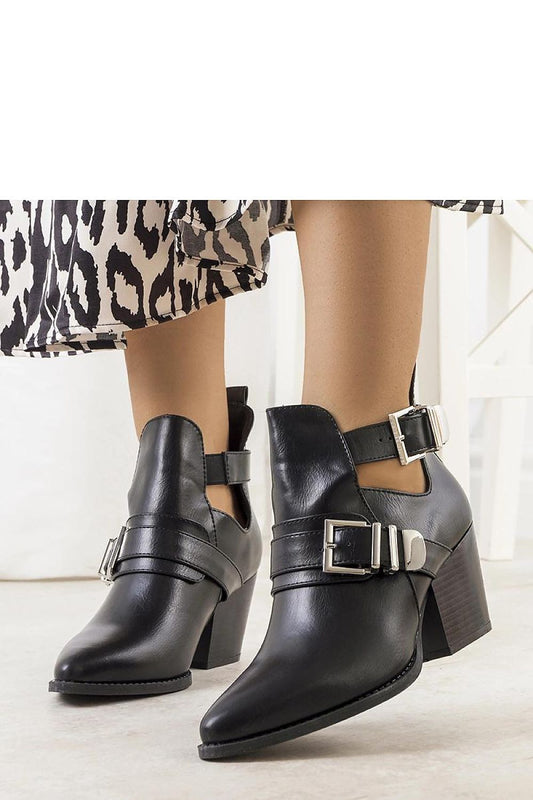 Elegant black cowboy-inspired ankle boots for women by Solea, featuring eco-friendly leather and adjustable ankle strap, perfect for stylish autumn and winter outfits.