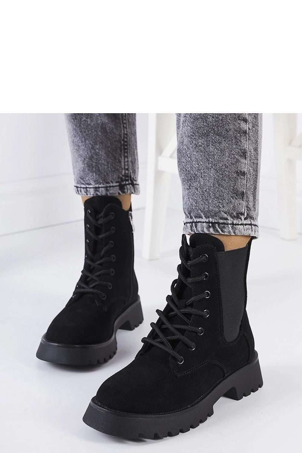 Sophisticated Solea ankle boots in rich brown eco leather, designed with a chunky sole, laced finish, and insulated interior for warmth.