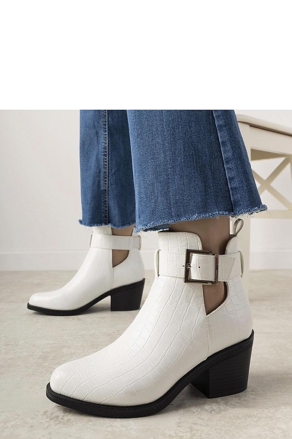 Elegant white ankle boots by Solea featuring cutouts and eco leather design, perfect for autumn wardrobe.