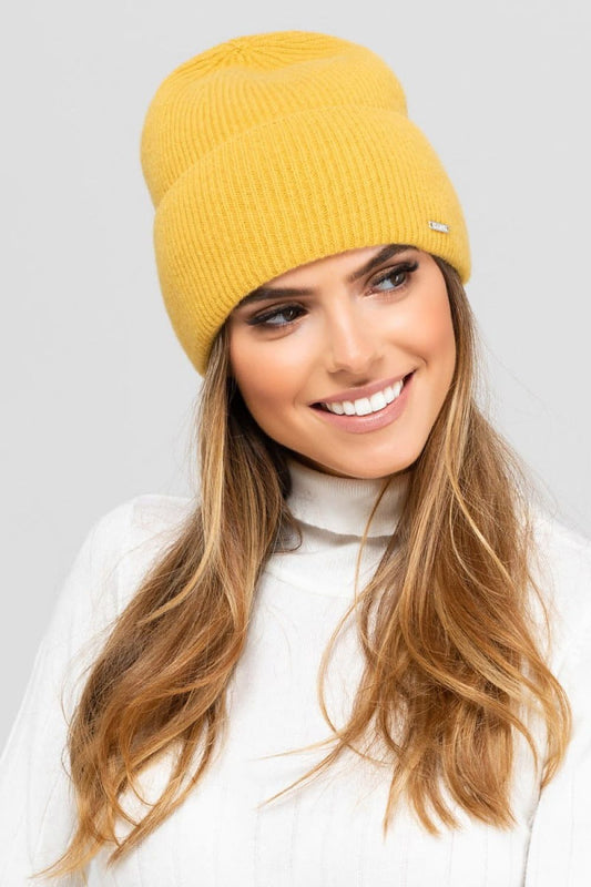 Elegant women's cap by Kamea, crafted from ultra-fine merino wool and cashmere, showcasing a stylish design that complements luxurious outfits.