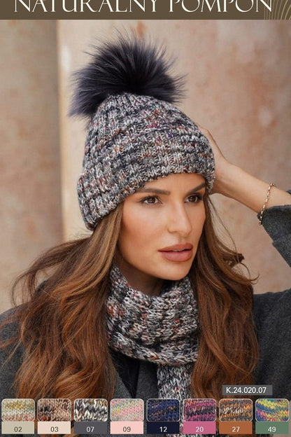 Kamea luxurious Pavone hat featuring a stylish pom-pom and elegant cuff, showcasing unique design and colourful texture for a chic winter look.